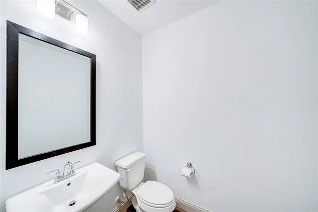 a kitchen with stainless steel appliances a refrigerator sink and stove