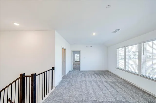 a view of a kitchen with a sink and wooden floor