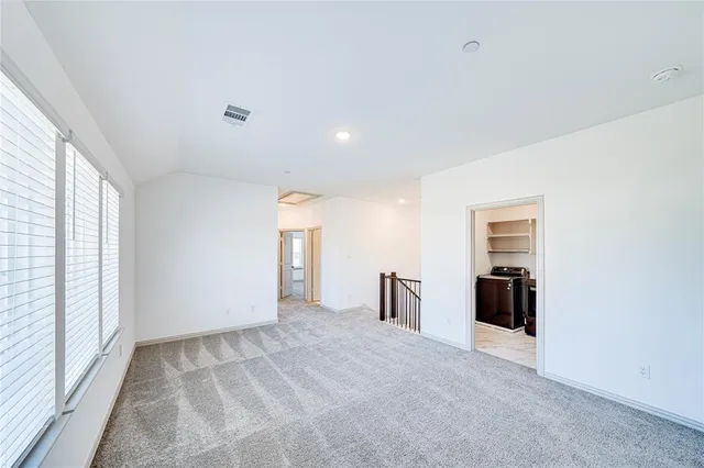 a view of cabinets and wooden floor
