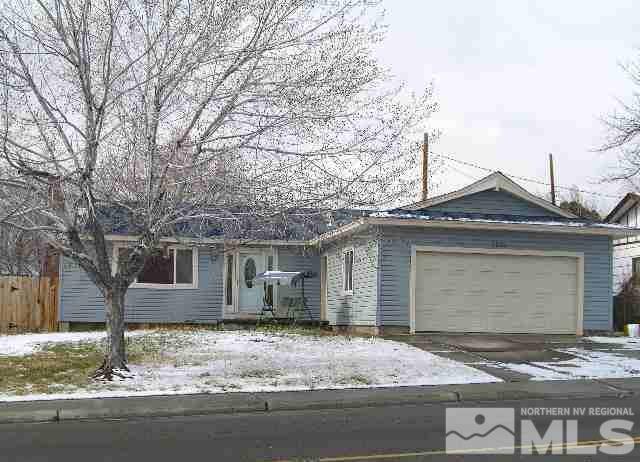 3220 Kings Row Reno, NV 89503 - Photo 1 of 1 a front view of a house with garden