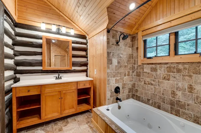 a kitchen with stainless steel appliances a refrigerator and a stove top oven