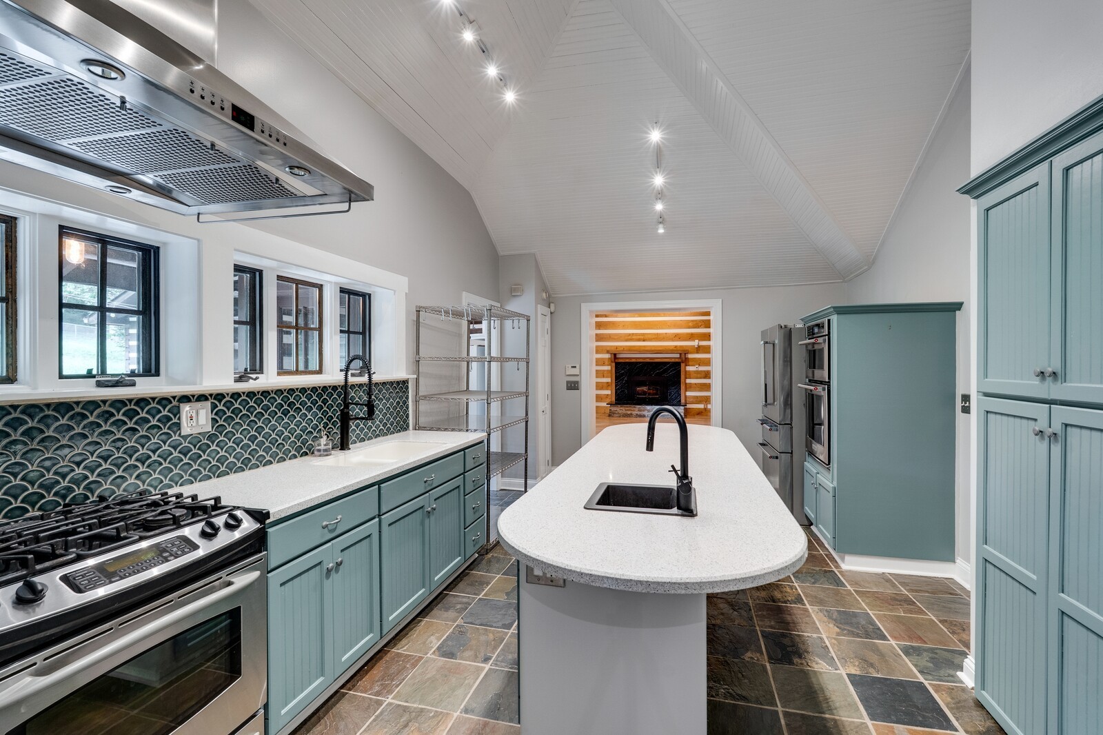 711 Hill Road Brentwood, TN 37027 - Photo 34 of 66 a kitchen with stainless steel appliances a sink a stove a refrigerator cabinets and furniture