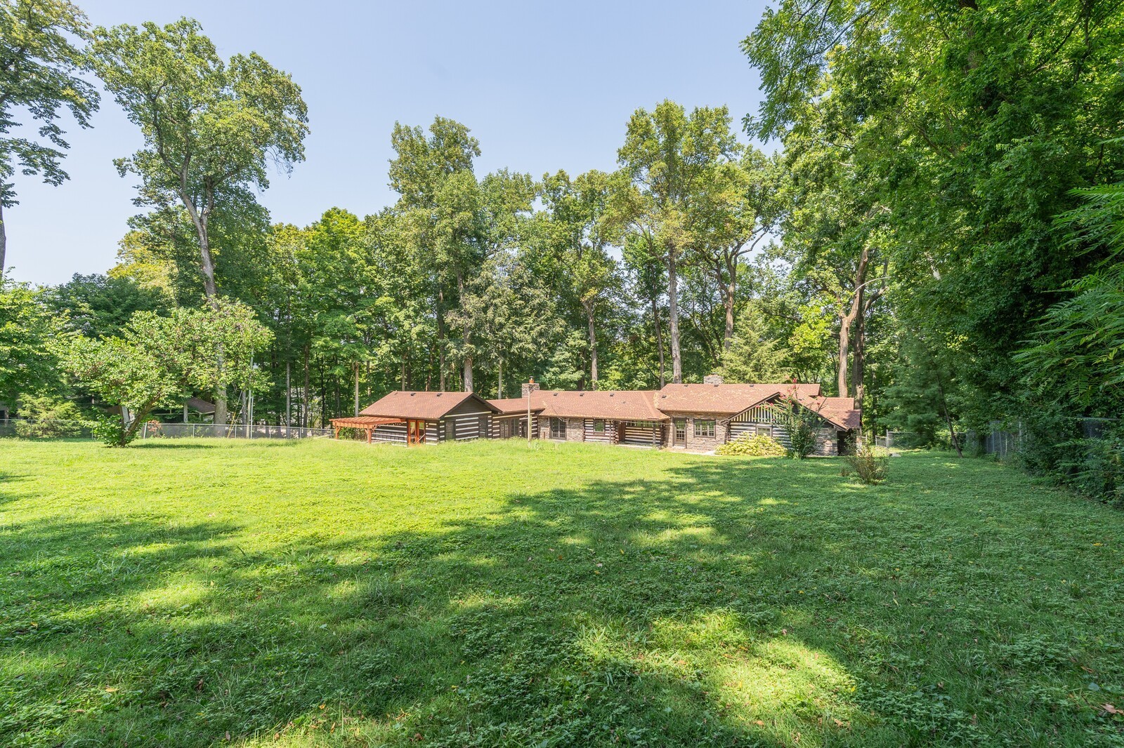 711 Hill Road Brentwood, TN 37027 - Photo 61 of 66 a backyard of a house with table and chairs