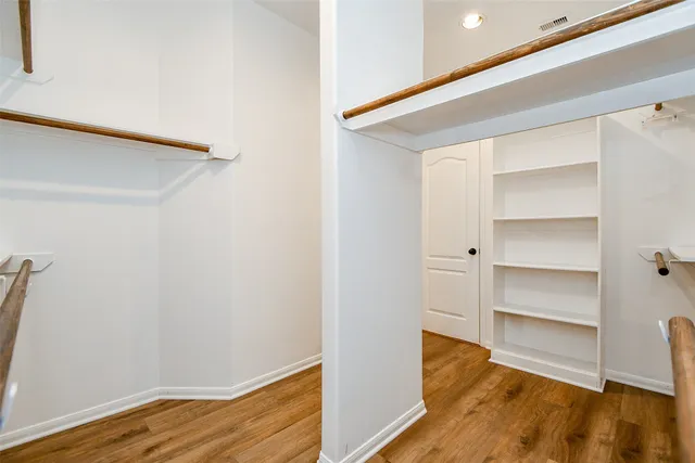 a view of a hallway with a chandelier