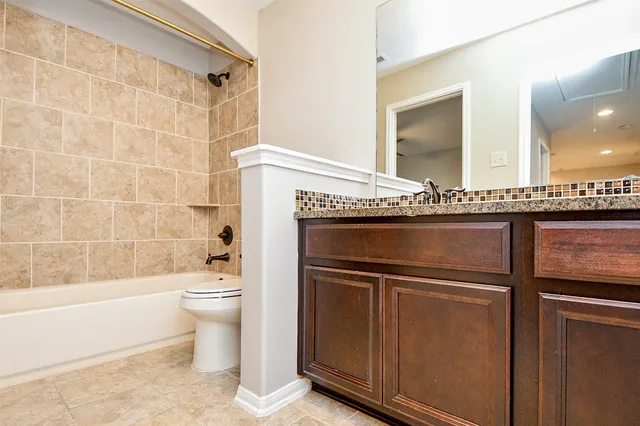a view of entryway stairs and hall with wooden floor