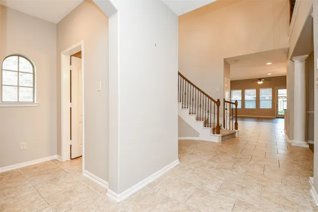 a view of entryway with wooden floor and a front door