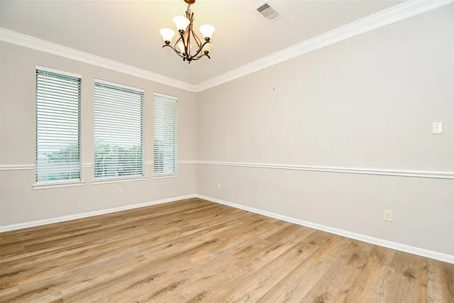 a large kitchen with kitchen island a sink stainless steel appliances and cabinets