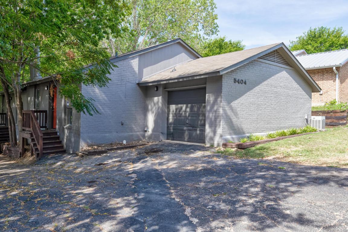 5404 Atascosa Drive Austin, TX 78744 - Photo 1 of 25 a view of a house with backyard and trees