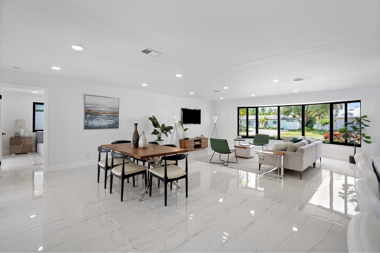 1200 Southwest 8th Street Boca Raton, FL 33486 - Photo 11 of 42 a living room with furniture and a flat screen tv