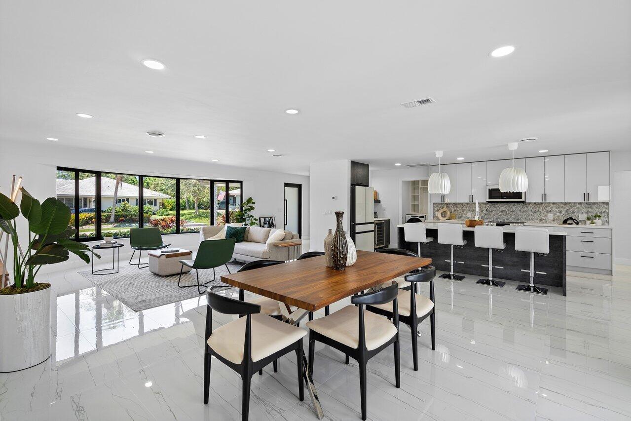 1200 Southwest 8th Street Boca Raton, FL 33486 - Photo 14 of 42 a view of kitchen with dining table and chairs