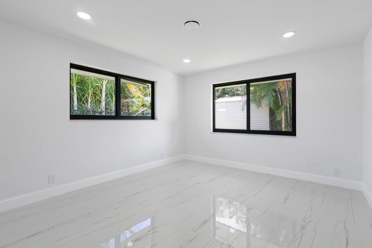 1200 Southwest 8th Street Boca Raton, FL 33486 - Photo 19 of 42 an empty room with windows