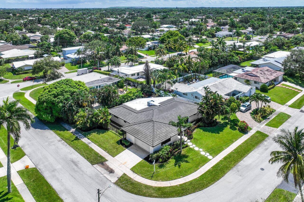 1200 Southwest 8th Street Boca Raton, FL 33486 - Photo 32 of 42 an aerial view of a house with a garden and lake view