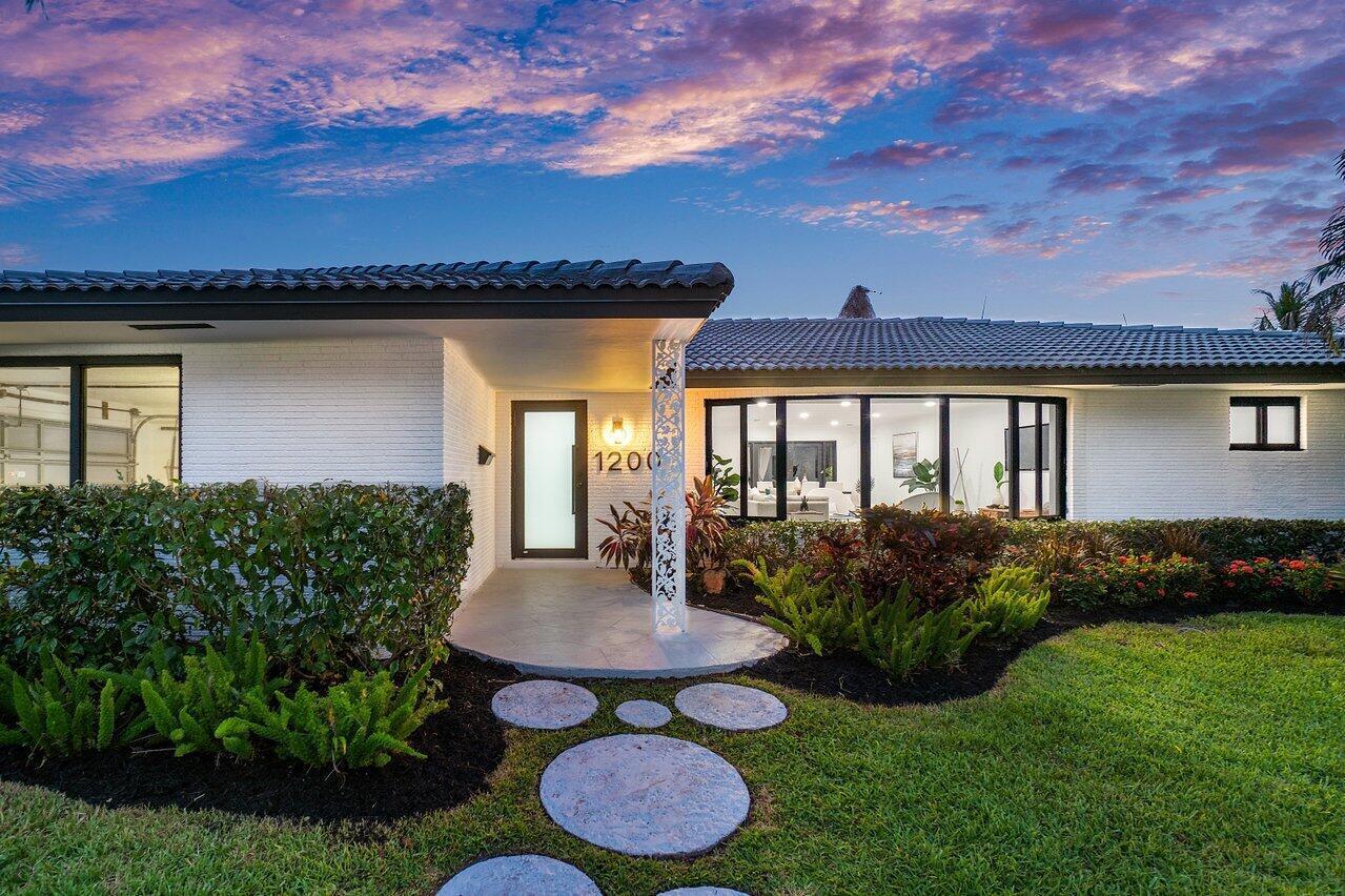 1200 Southwest 8th Street Boca Raton, FL 33486 - Photo 36 of 42 a view of a house with backyard and a garden