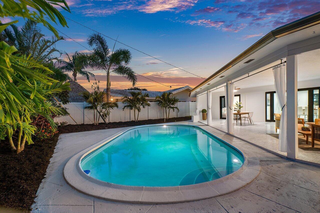 1200 Southwest 8th Street Boca Raton, FL 33486 - Photo 39 of 42 a view of a swimming pool with an outdoor seating