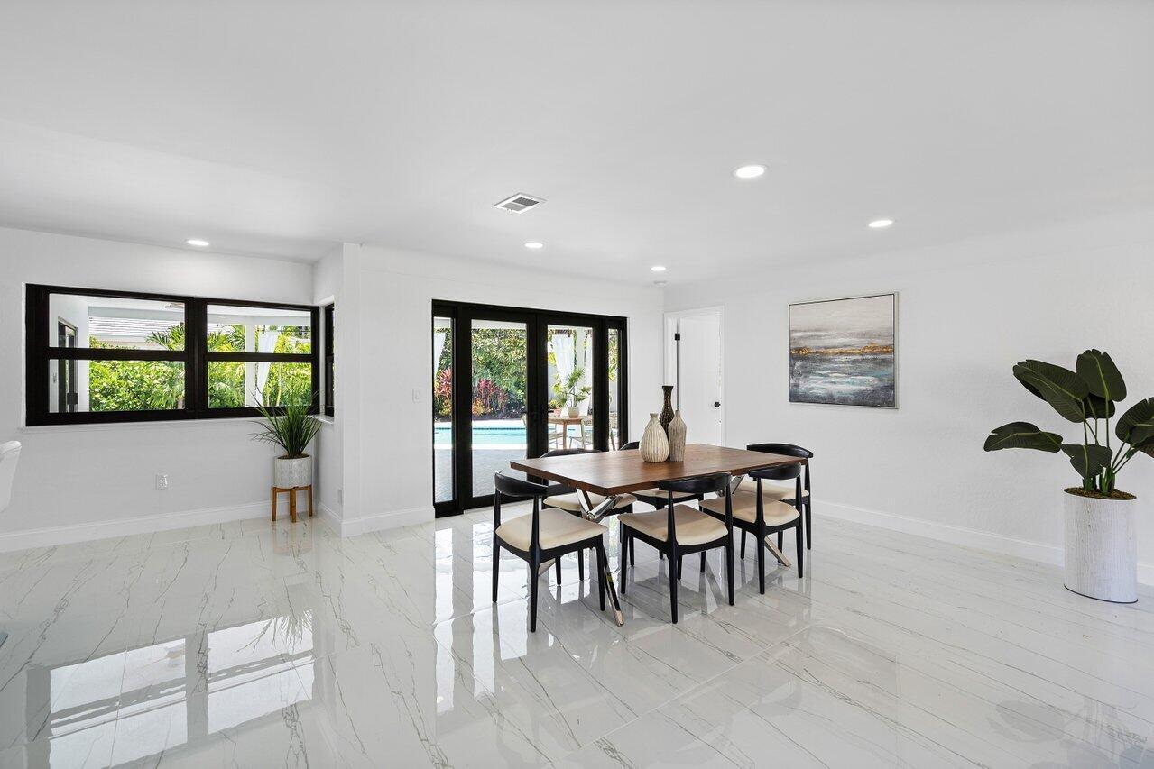 1200 Southwest 8th Street Boca Raton, FL 33486 - Photo 9 of 42 a view of a dining room with furniture and a window