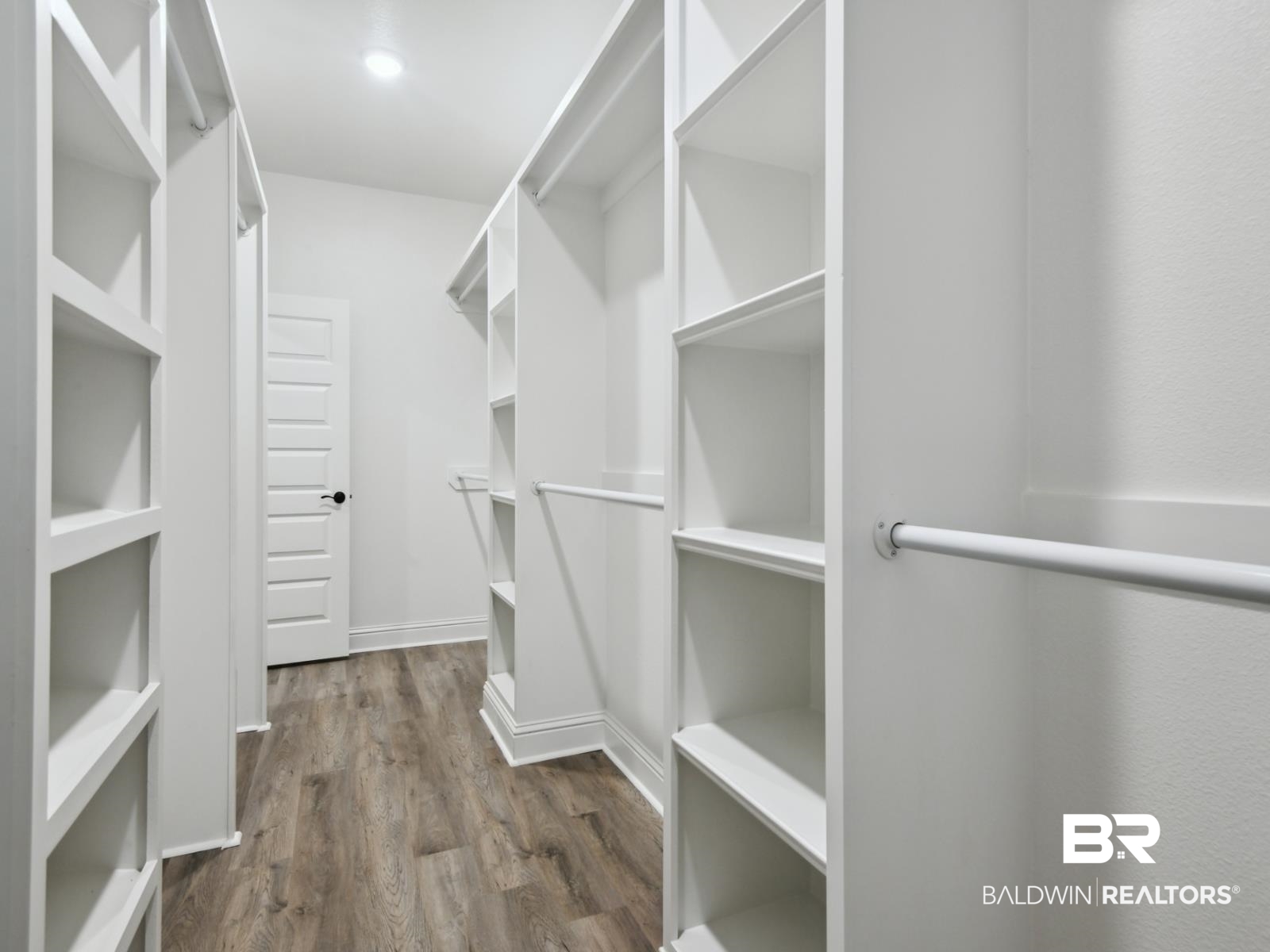 23937 Peppermint Street Elberta, AL 36530 - Photo 13 of 22 Walk in closet with dark wood-style flooring