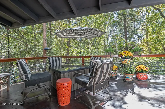 a view of a chairs and table in the patio