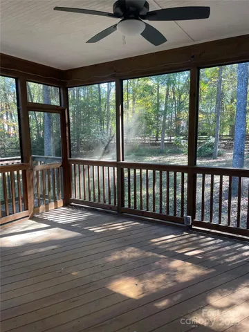 a view of a balcony with wooden floor