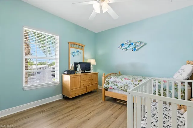 a bedroom with furniture and a window