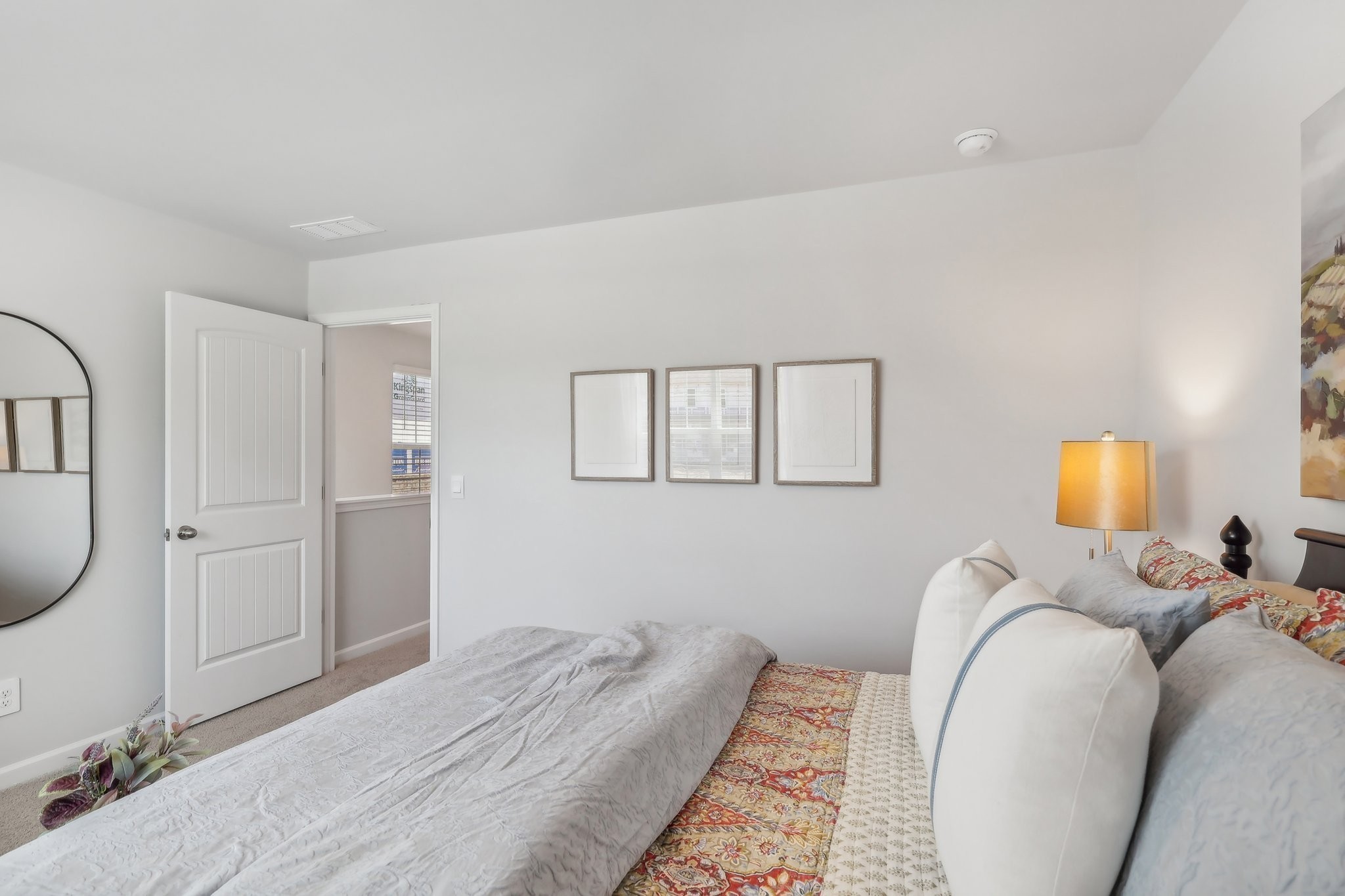 914 Highfield Way Lebanon, TN 37087 - Photo 12 of 29 a bed room with a bed and a painting on the wall