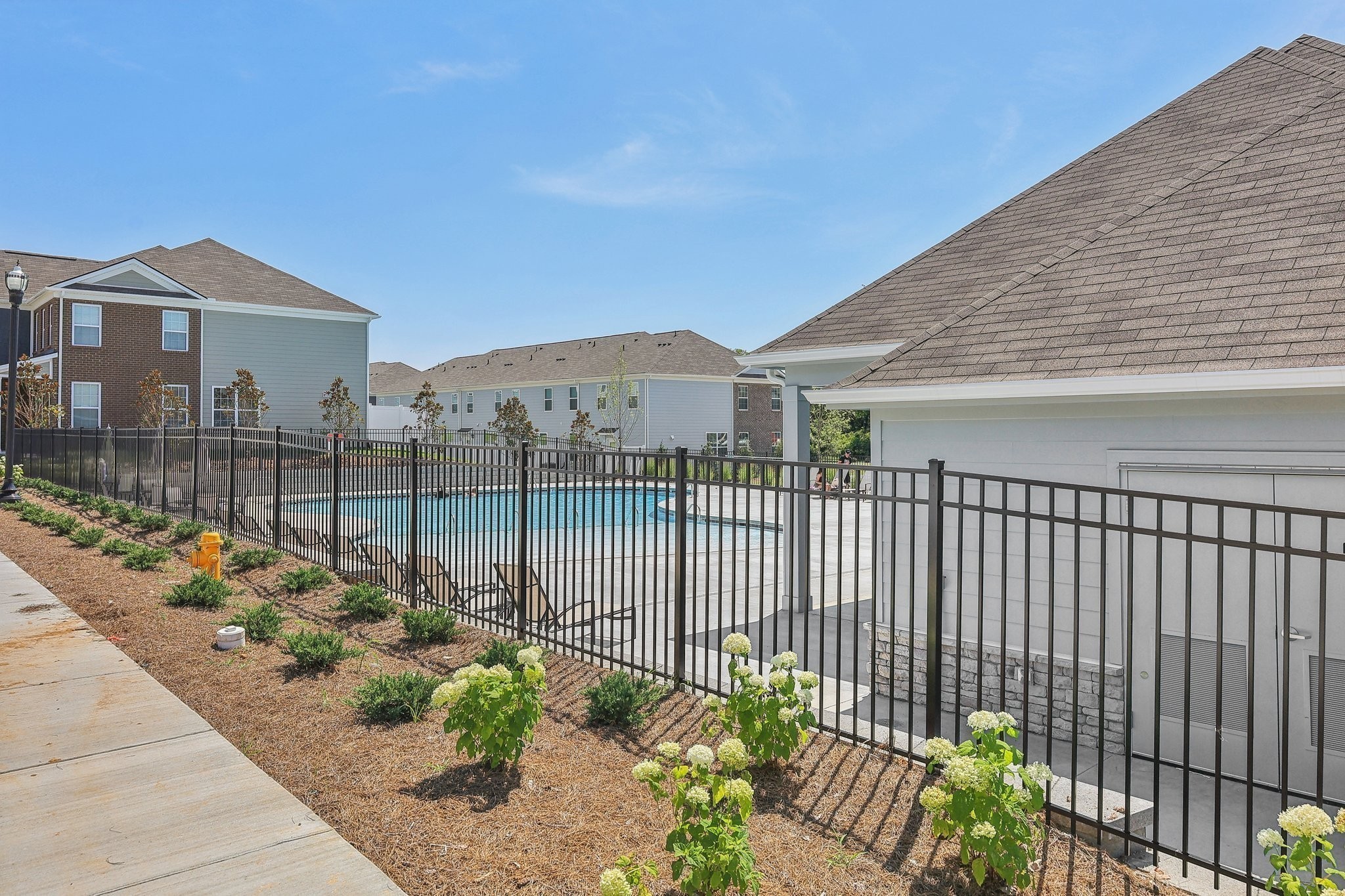 914 Highfield Way Lebanon, TN 37087 - Photo 27 of 29 a view of a brick house with a flower garden