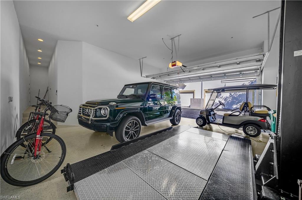 6552 Dominica Drive, Unit 101 Naples, FL 34113 - Photo 29 of 50 a car parked in garage