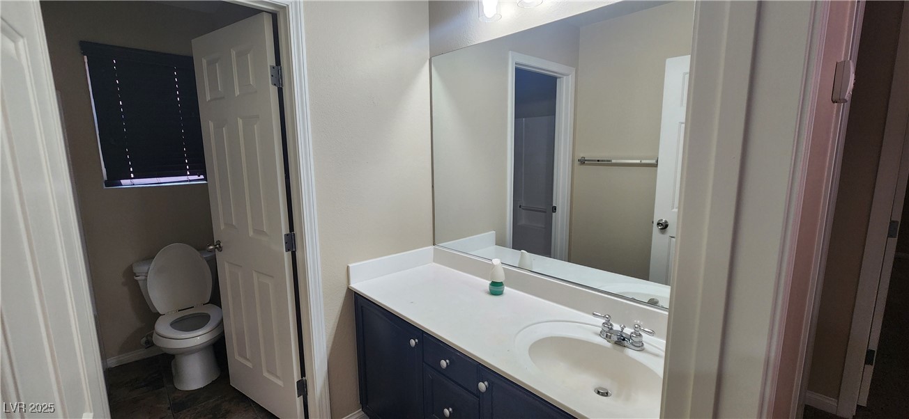 10211 Glimmering Star Drive Las Vegas, NV 89178 - Photo 12 of 33 Bathroom with vanity and toilet