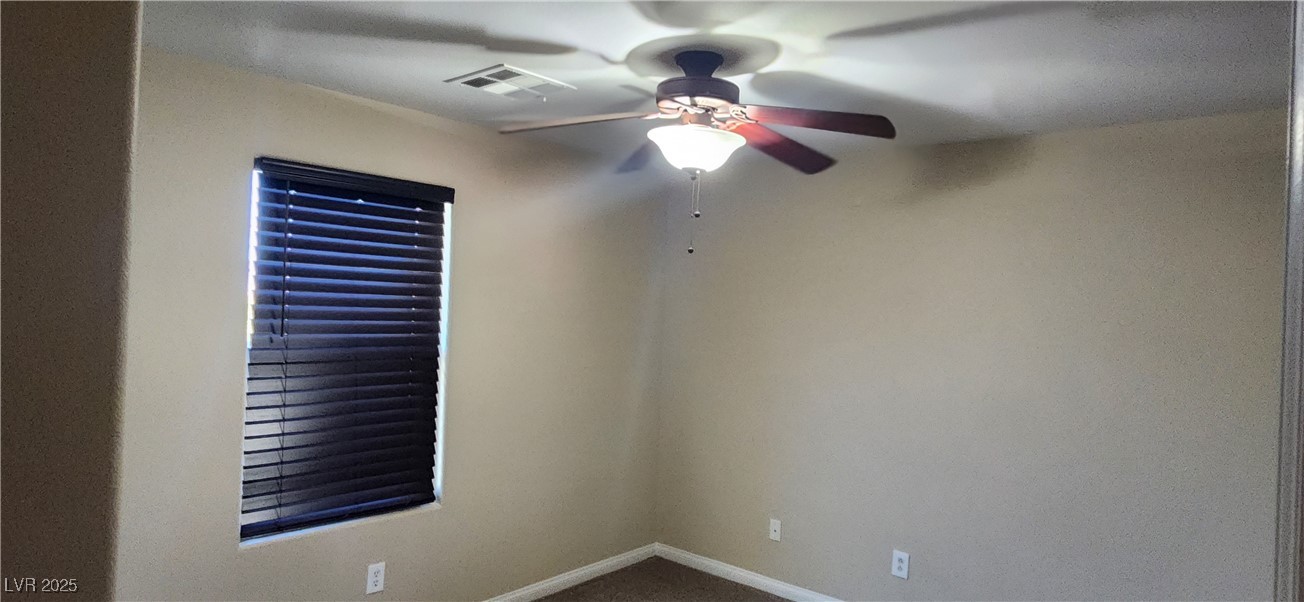 10211 Glimmering Star Drive Las Vegas, NV 89178 - Photo 13 of 33 Unfurnished room featuring a ceiling fan and baseboards