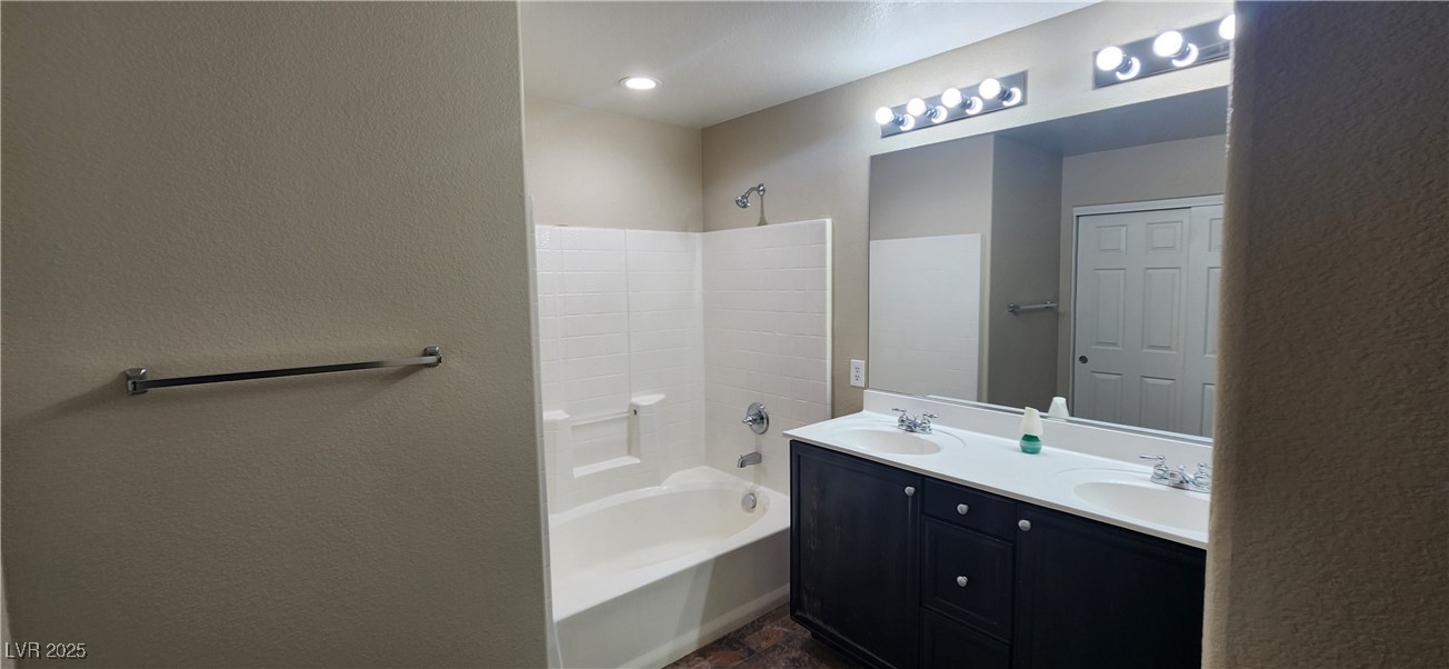 10211 Glimmering Star Drive Las Vegas, NV 89178 - Photo 14 of 33 Full bath featuring a textured wall, tub / shower combination, and double vanity