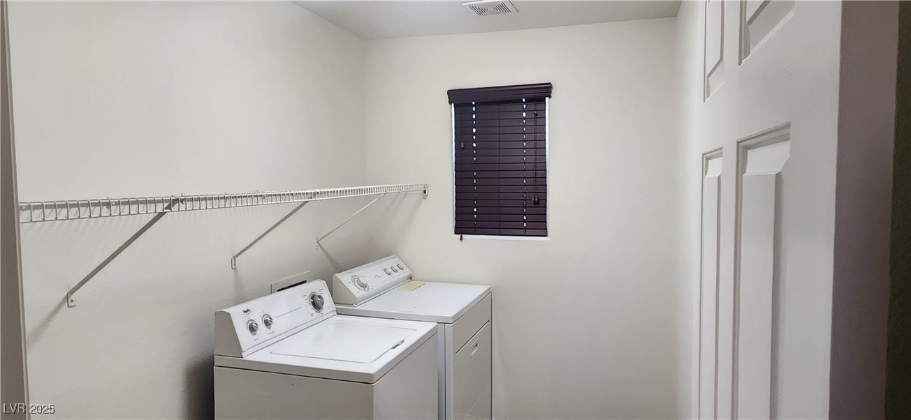 10211 Glimmering Star Drive Las Vegas, NV 89178 - Photo 23 of 33 Washroom with washer and dryer