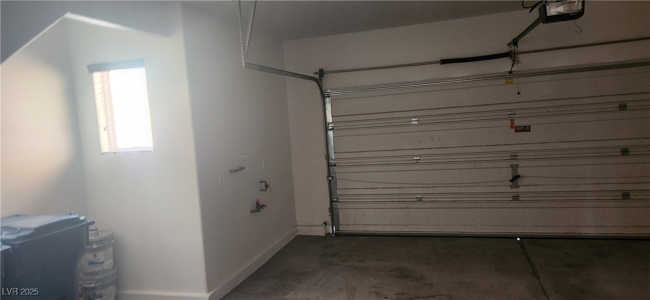 10211 Glimmering Star Drive Las Vegas, NV 89178 - Photo 29 of 33 Garage with baseboards and a garage door opener