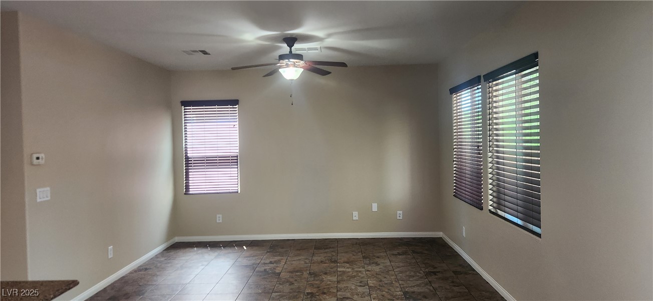 10211 Glimmering Star Drive Las Vegas, NV 89178 - Photo 3 of 33 Spare room with ceiling fan and plenty of natural light