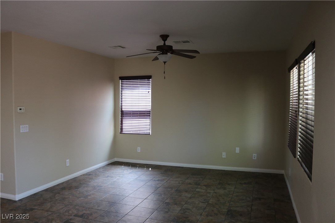 10211 Glimmering Star Drive Las Vegas, NV 89178 - Photo 8 of 33 Unfurnished room with ceiling fan and baseboards