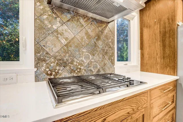 a view of a kitchen with wooden floor and a sink