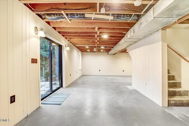 a view of a room with wooden floors