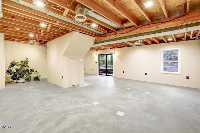 a view of a wooden deck with chairs