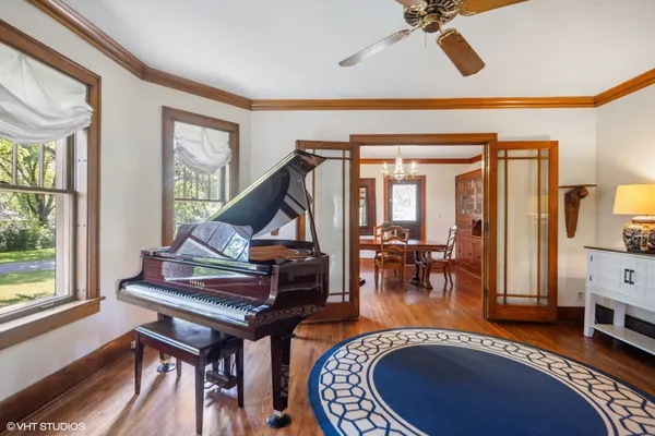 a living room with furniture a rug and a window