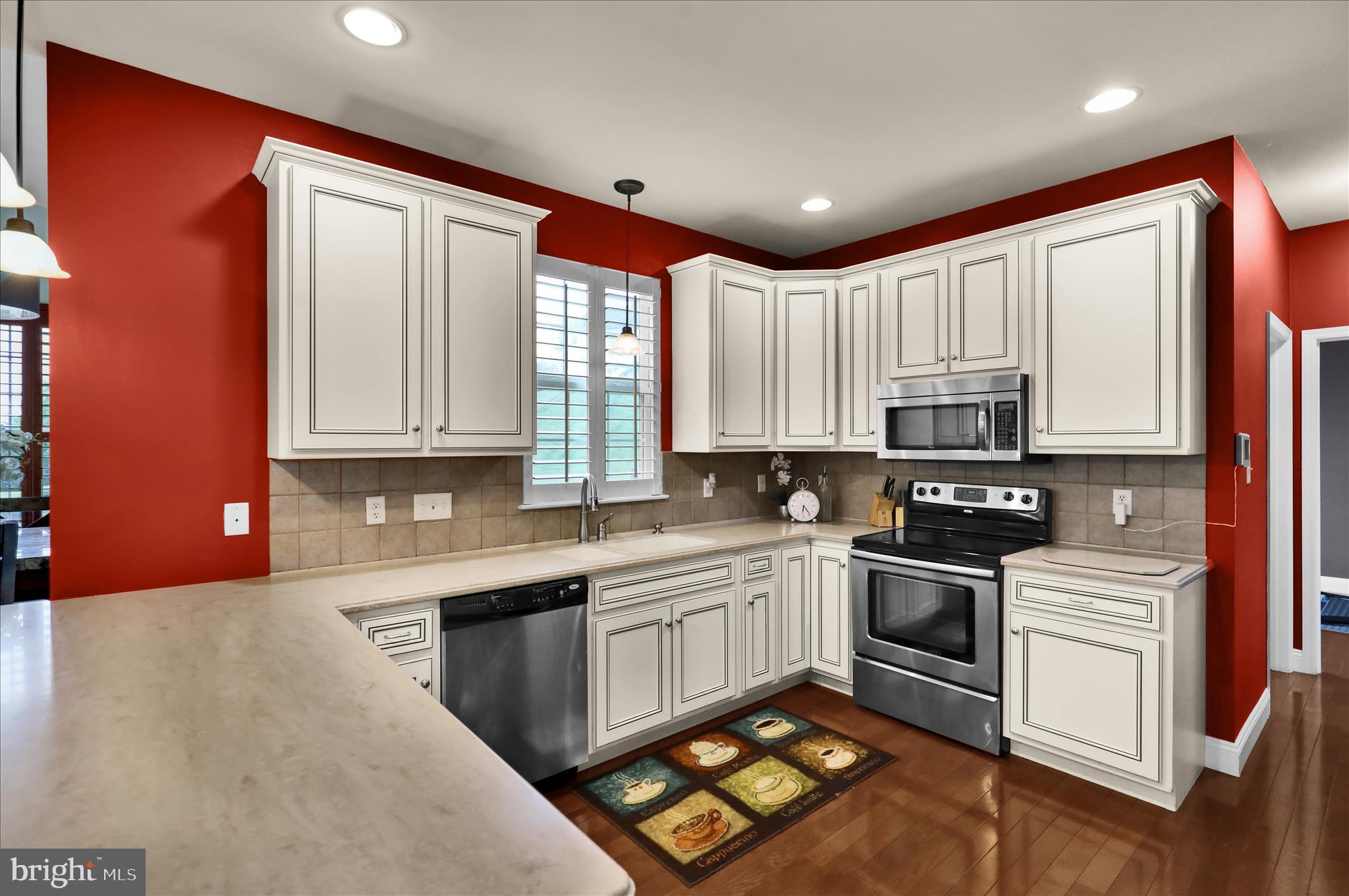 121 Great Bend Way Sinking Spring, PA 19608 - Photo 17 of 59 a kitchen with stainless steel appliances granite countertop a sink stove and microwave