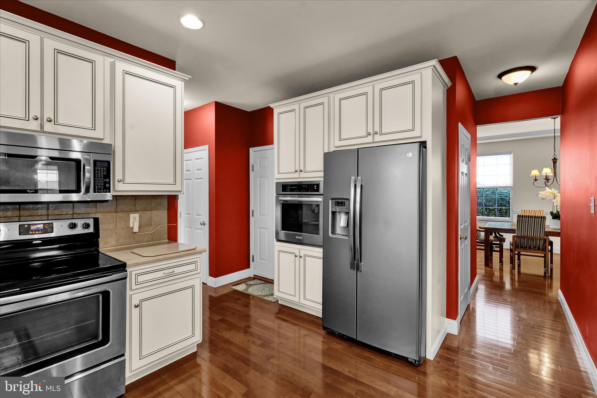 121 Great Bend Way Sinking Spring, PA 19608 - Photo 19 of 59 a kitchen with stainless steel appliances a refrigerator stove and microwave