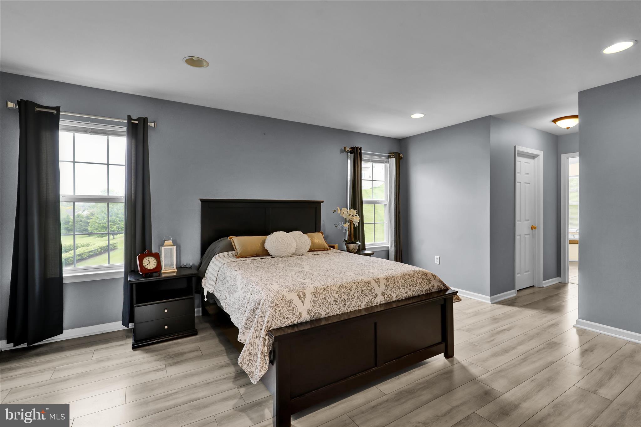 121 Great Bend Way Sinking Spring, PA 19608 - Photo 23 of 59 a bedroom with a bed and wooden floor