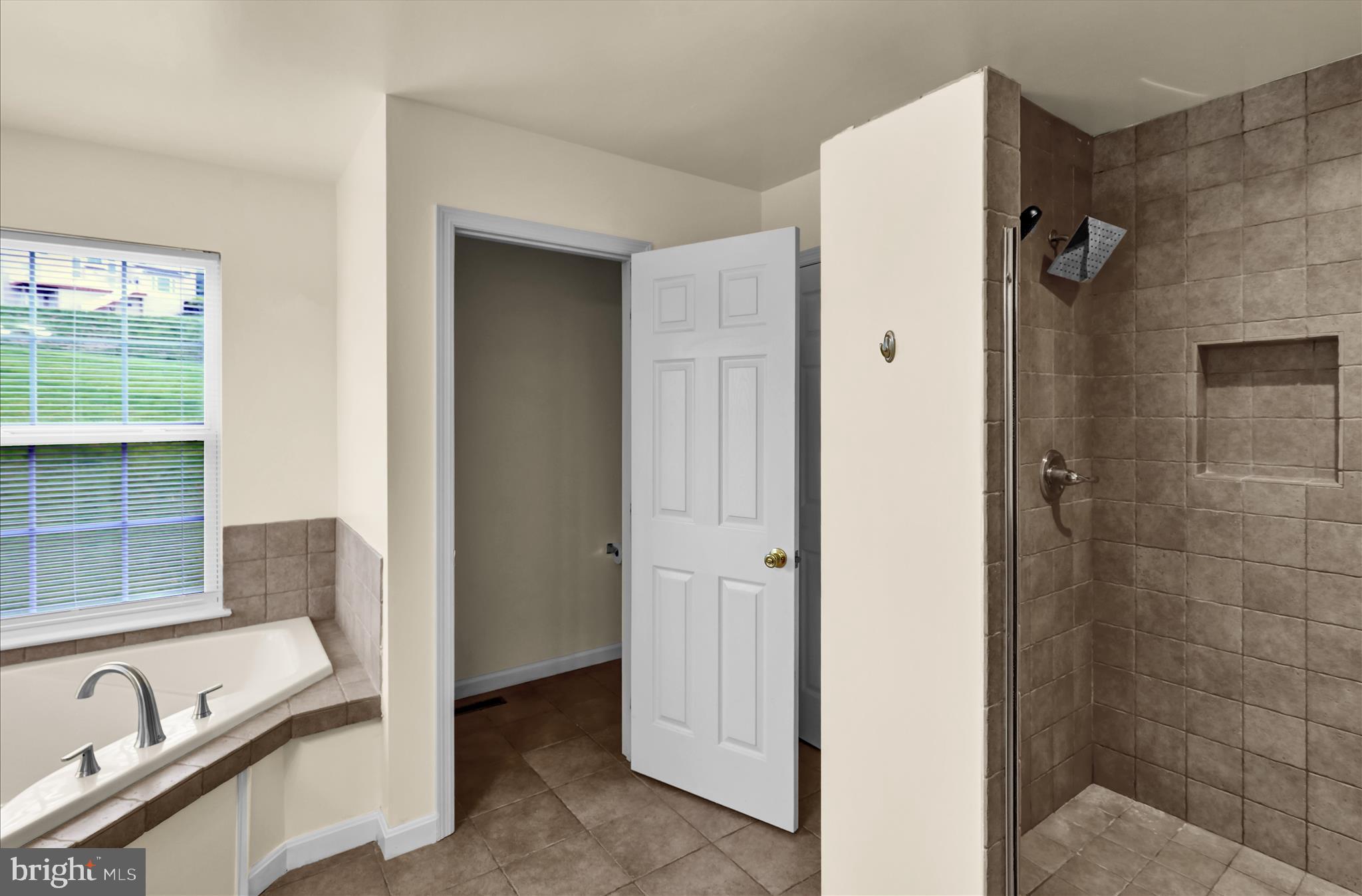 121 Great Bend Way Sinking Spring, PA 19608 - Photo 28 of 59 a bathroom with a tub sink and mirror