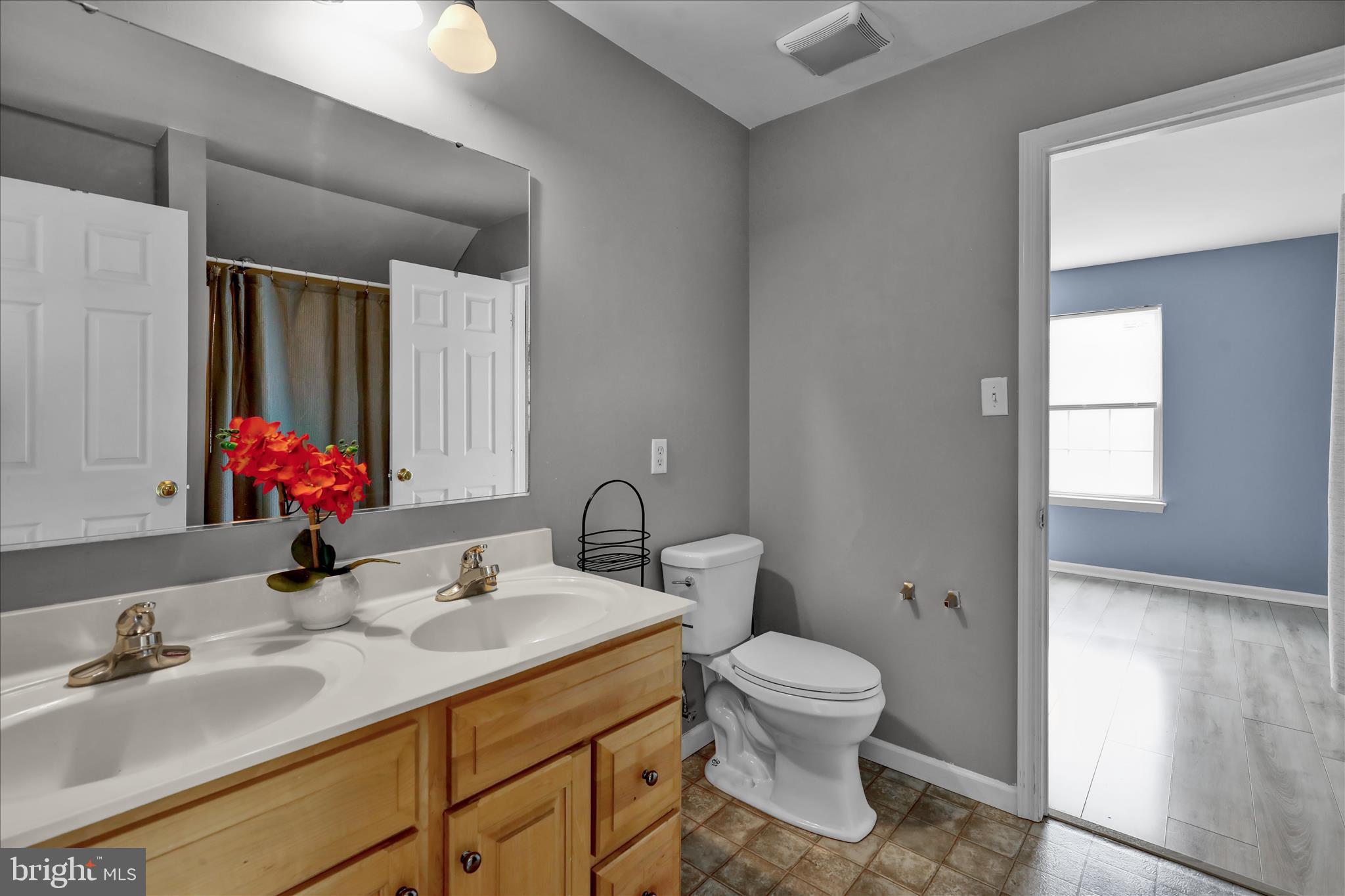 121 Great Bend Way Sinking Spring, PA 19608 - Photo 35 of 59 a bathroom with a toilet sink and mirror