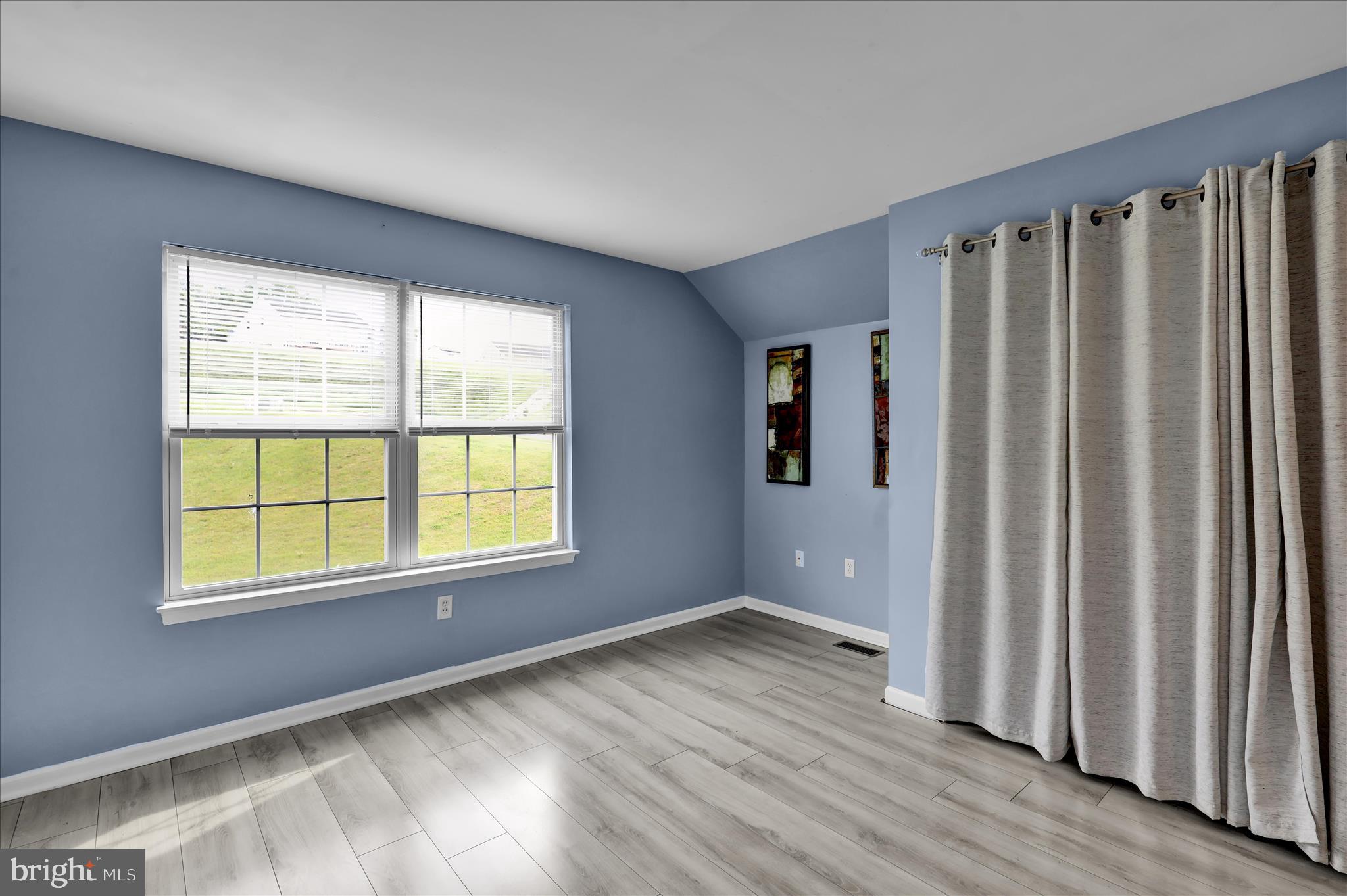 121 Great Bend Way Sinking Spring, PA 19608 - Photo 36 of 59 an empty room with wooden floor and windows