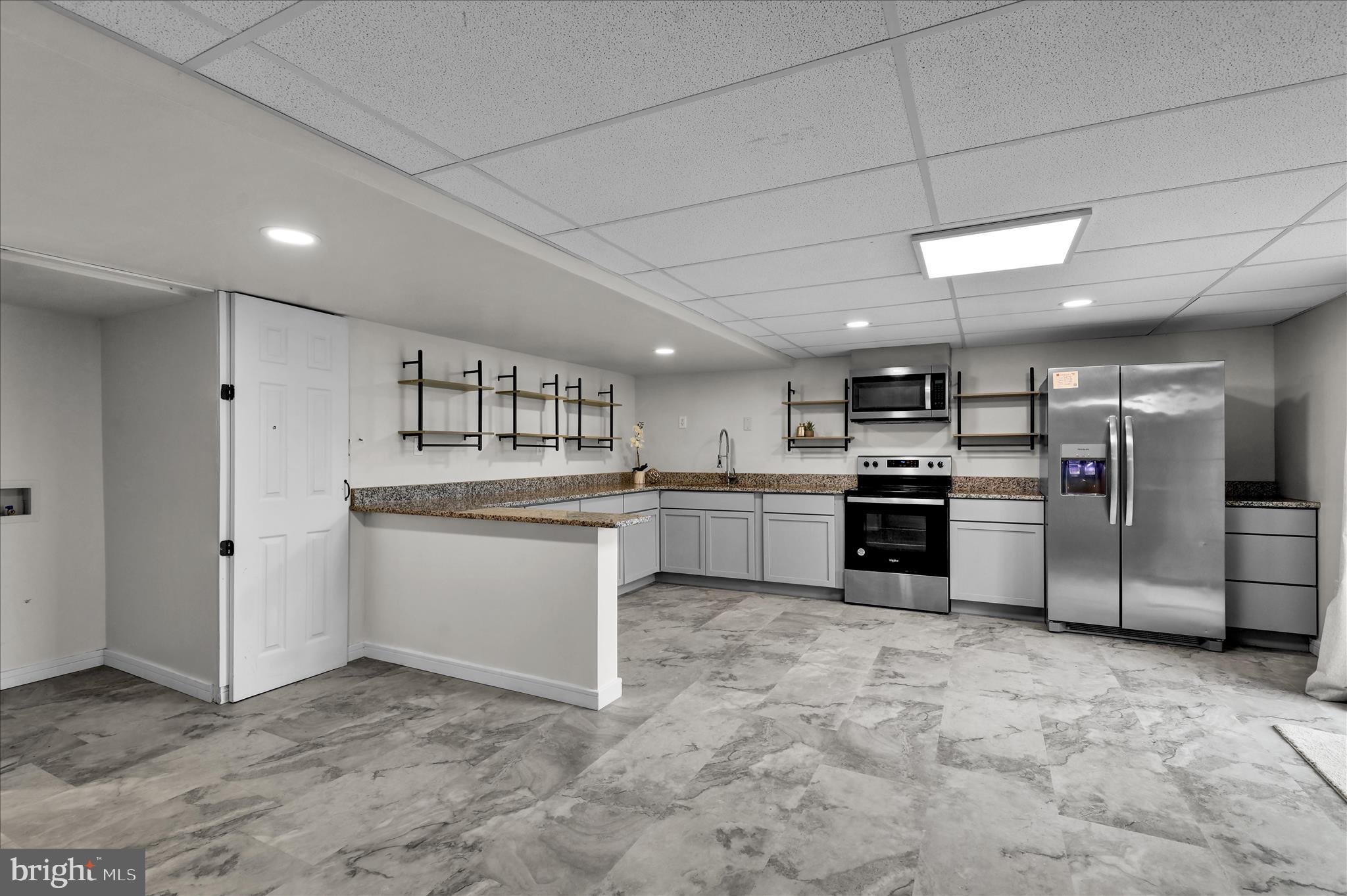 121 Great Bend Way Sinking Spring, PA 19608 - Photo 46 of 59 a kitchen with white cabinets and stainless steel appliances