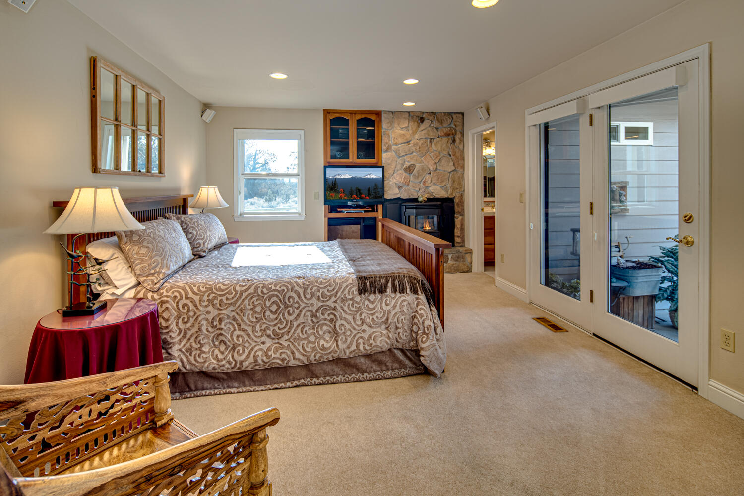 66250 Gerking Market Road Bend, OR 97703 - Photo 30 of 86 Lower level Primary bedroom with en-suite bath & exterior access to private patio