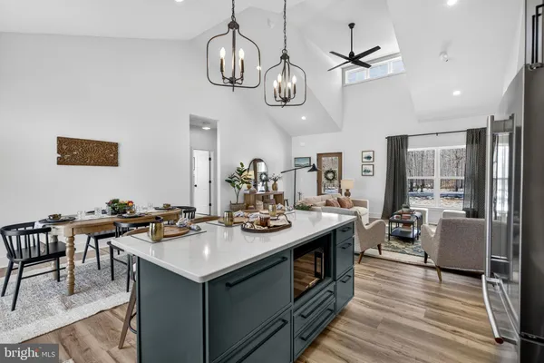 a dining room with furniture and wooden floor