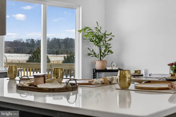 a white wall with a painting on the wall