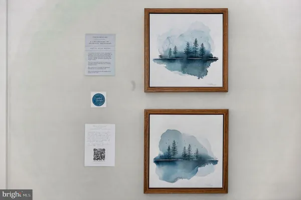 a view of walk in closet with clothes