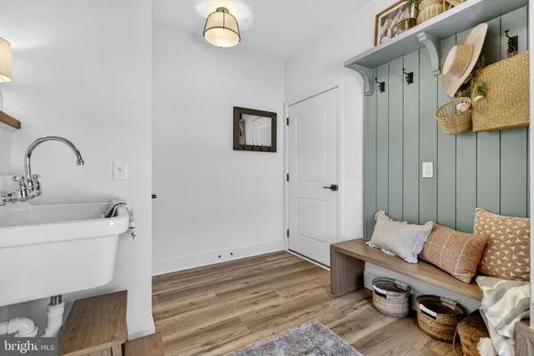 an aerial view of a house with a yard big trees