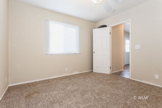 640 Sydnor Avenue Ridgecrest, CA 93555 - Photo 18 of 28 an empty room with windows